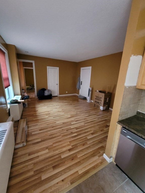140 Chestnut Street, Unit 715 Springfield, MA 01103 - Photo 4 of 13 a view of a livingroom with wooden floor and lounge chairs