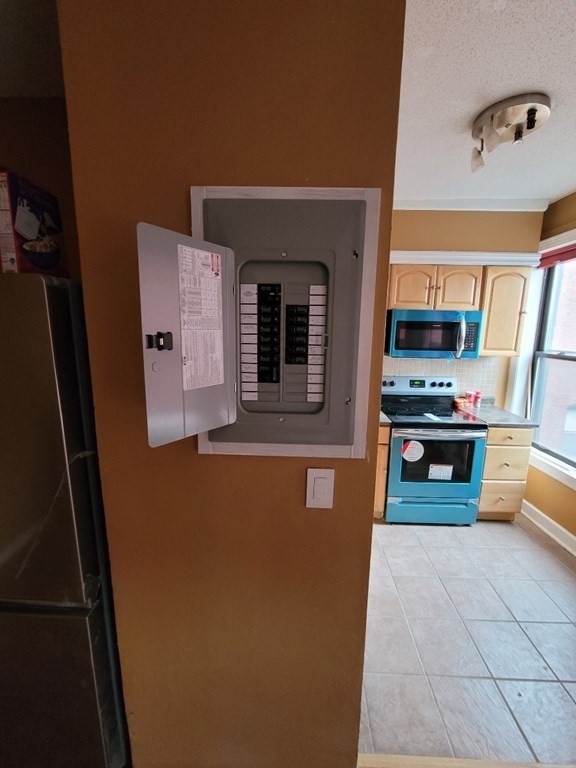 140 Chestnut Street, Unit 715 Springfield, MA 01103 - Photo 8 of 13 a kitchen with stainless steel appliances a refrigerator and a stove top oven