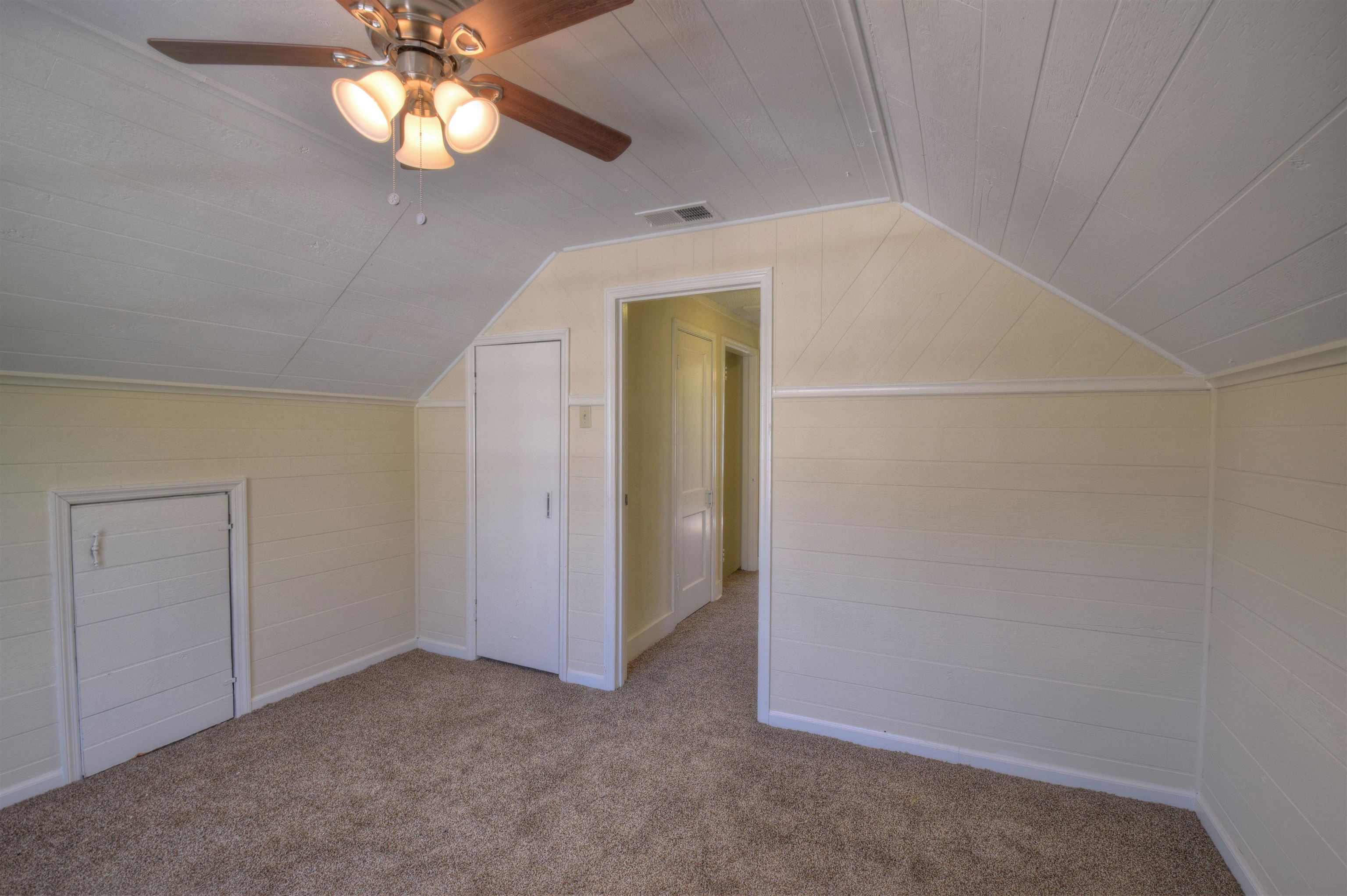 3632 Carrington Road Memphis, TN 38111 - Photo 5 of 8 an empty room with a chandelier fan and closet