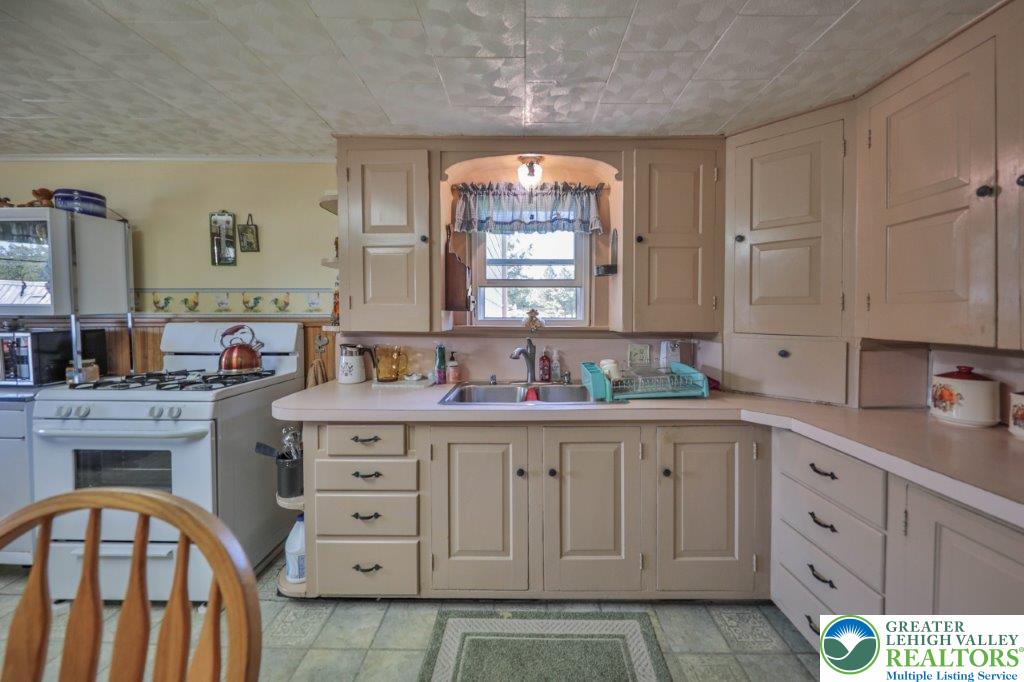 2485 Summer Mountain Road Palmerton, PA 18071 - Photo 12 of 38 a spacious bathroom with a double vanity sink a mirror and a