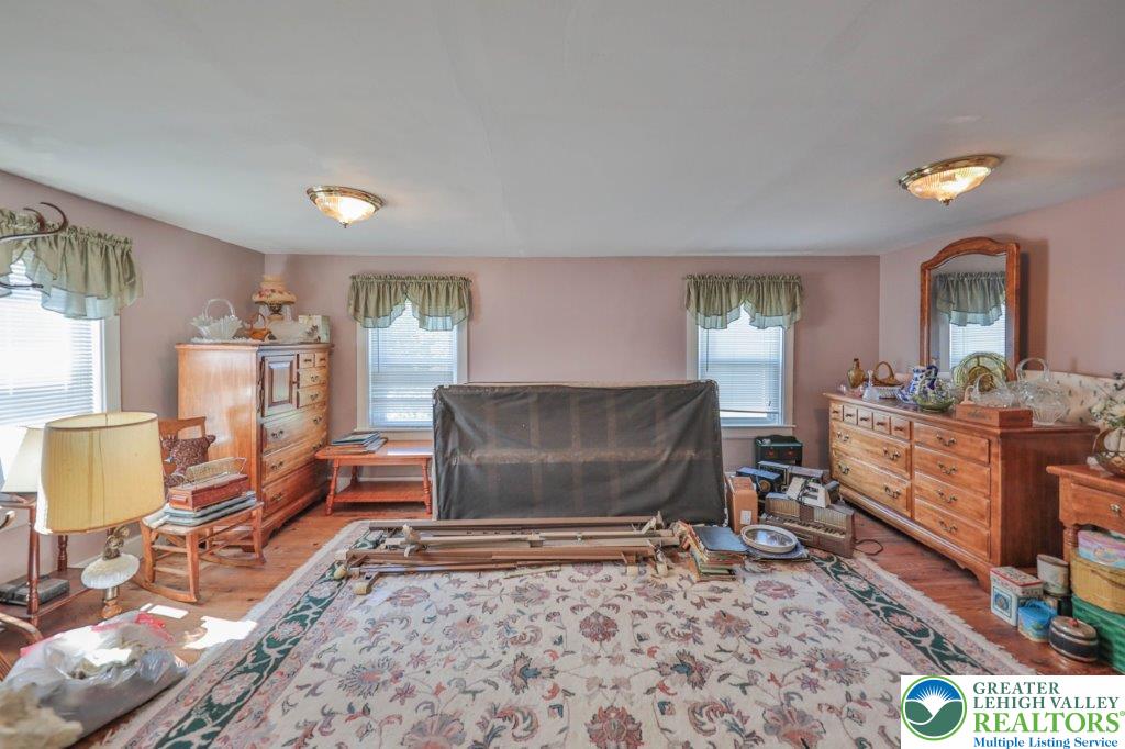 2485 Summer Mountain Road Palmerton, PA 18071 - Photo 24 of 38 a living room with furniture a flat screen tv and a table