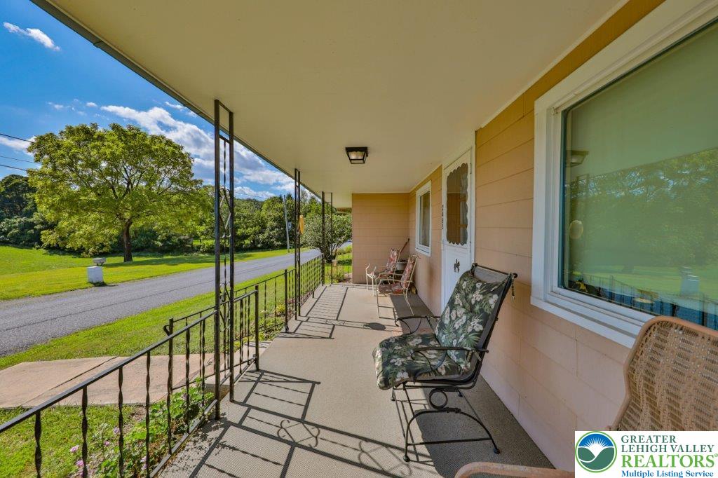 2485 Summer Mountain Road Palmerton, PA 18071 - Photo 27 of 38 a view of an chairs and tables in the balcony