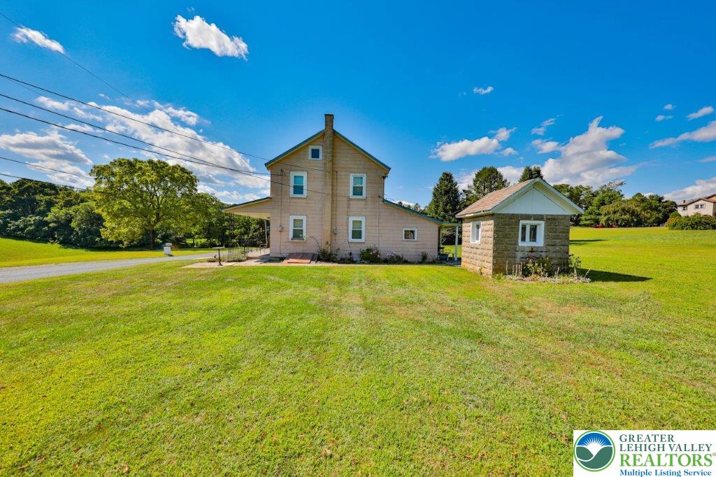 2485 Summer Mountain Road Palmerton, PA 18071 - Photo 31 of 38 a front view of a house with yard and garage