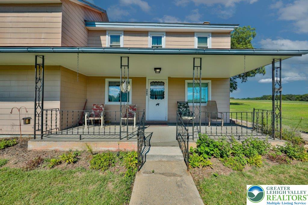 2485 Summer Mountain Road Palmerton, PA 18071 - Photo 6 of 38 a front view of a house with garden