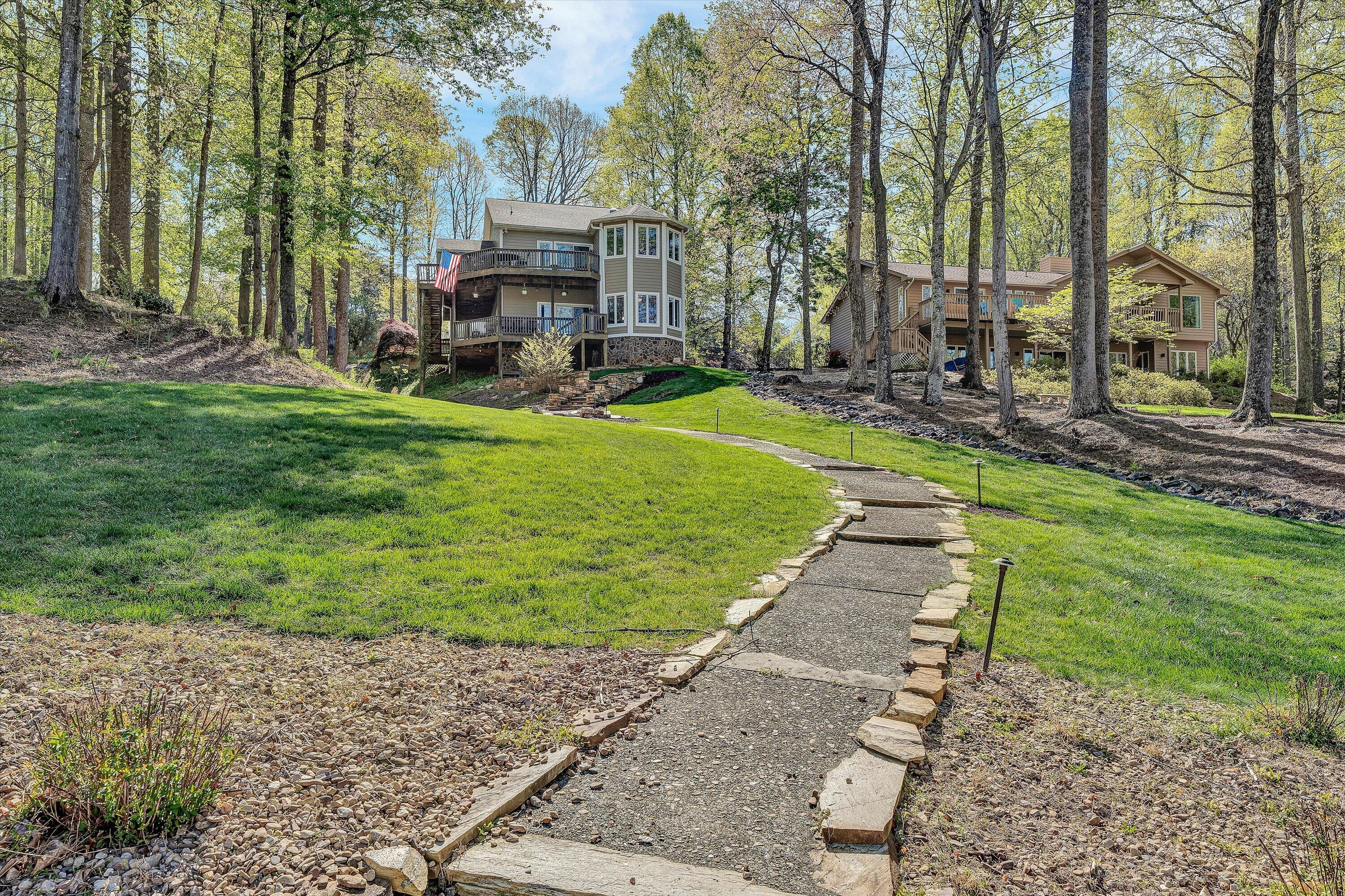 145 Channelview Drive Moneta, VA 24121 - Photo 13 of 62 a view of a house with backyard and sitting area
