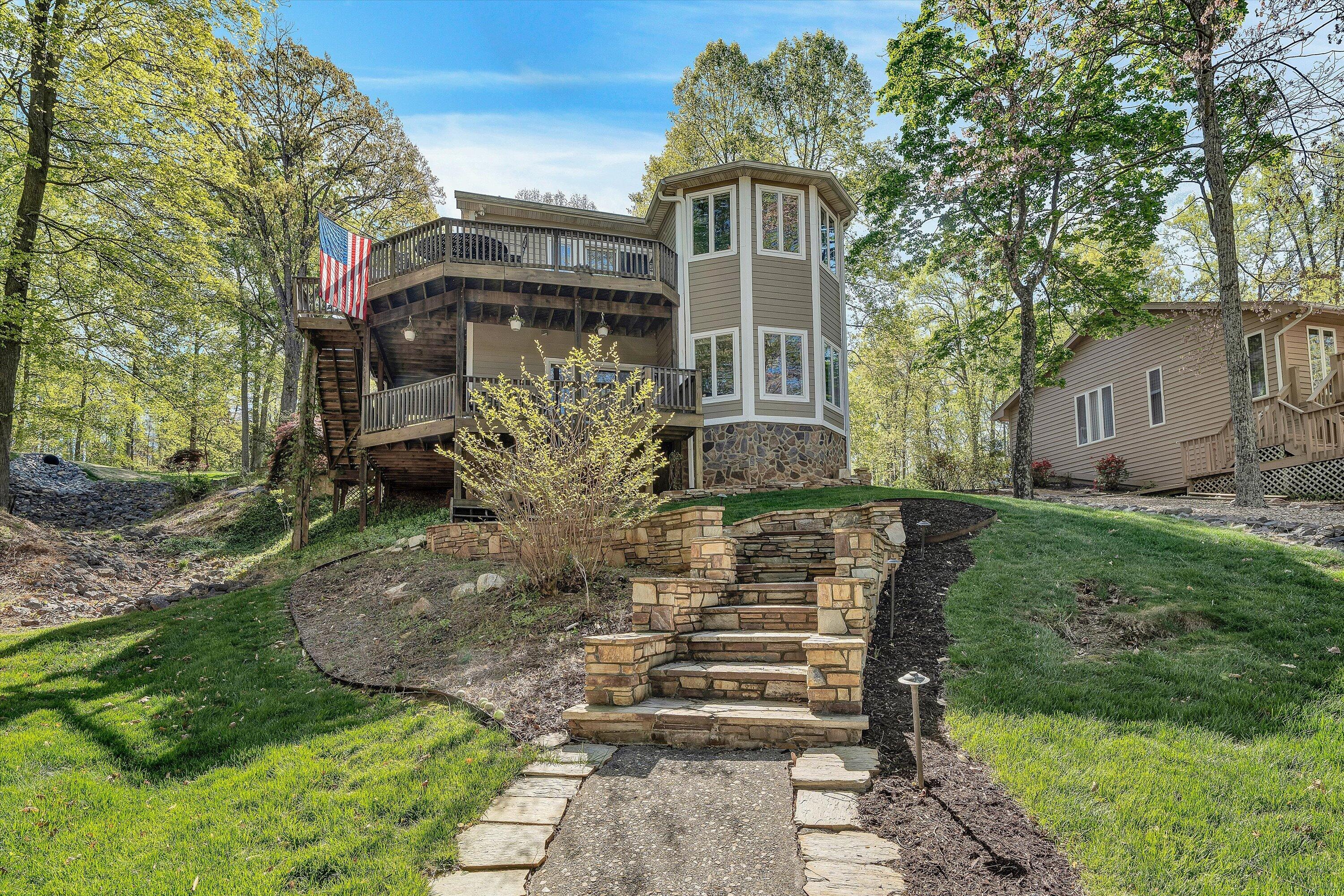 145 Channelview Drive Moneta, VA 24121 - Photo 15 of 62 a front view of a house with garden