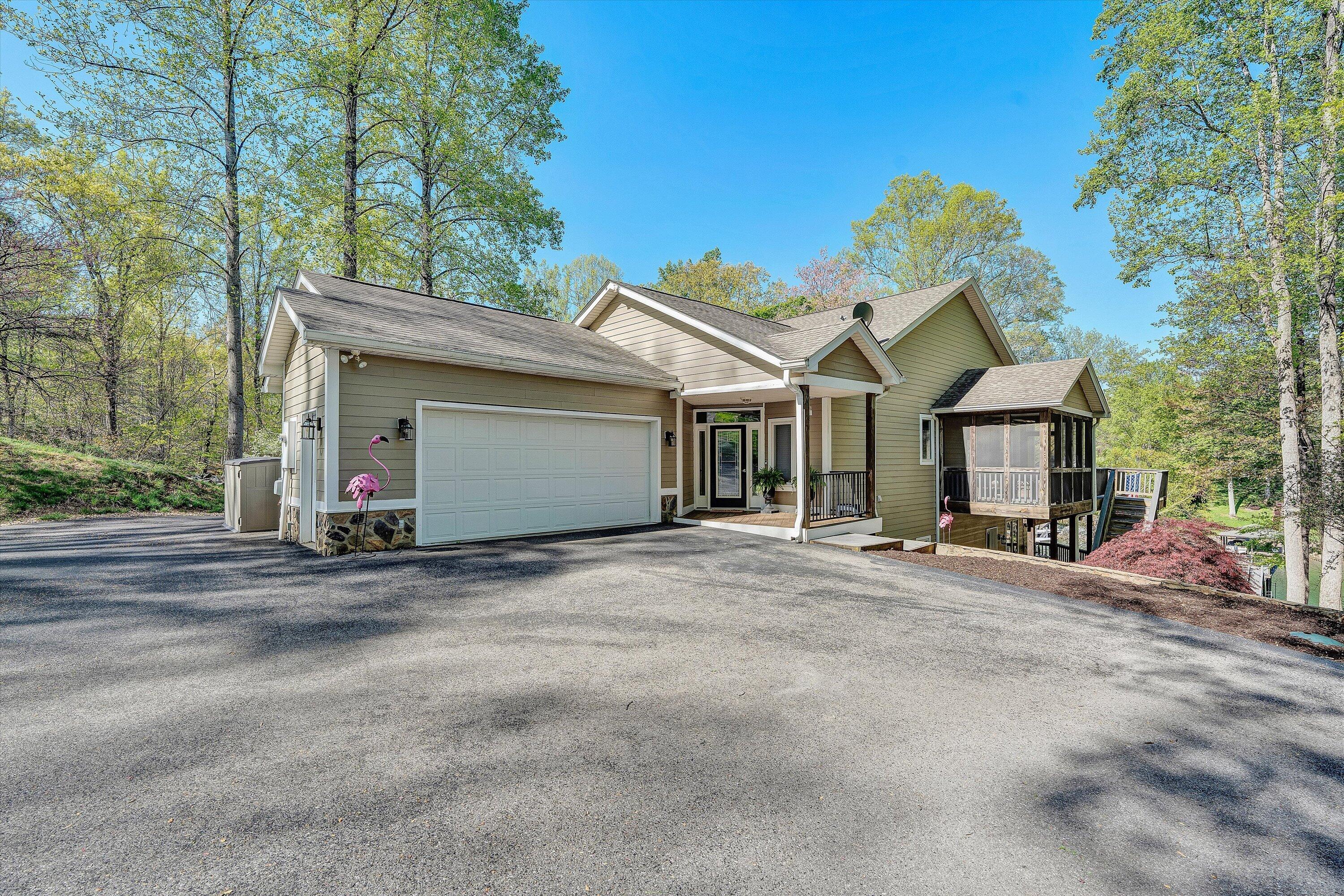145 Channelview Drive Moneta, VA 24121 - Photo 21 of 62 a view of a house with a outdoor space and trees