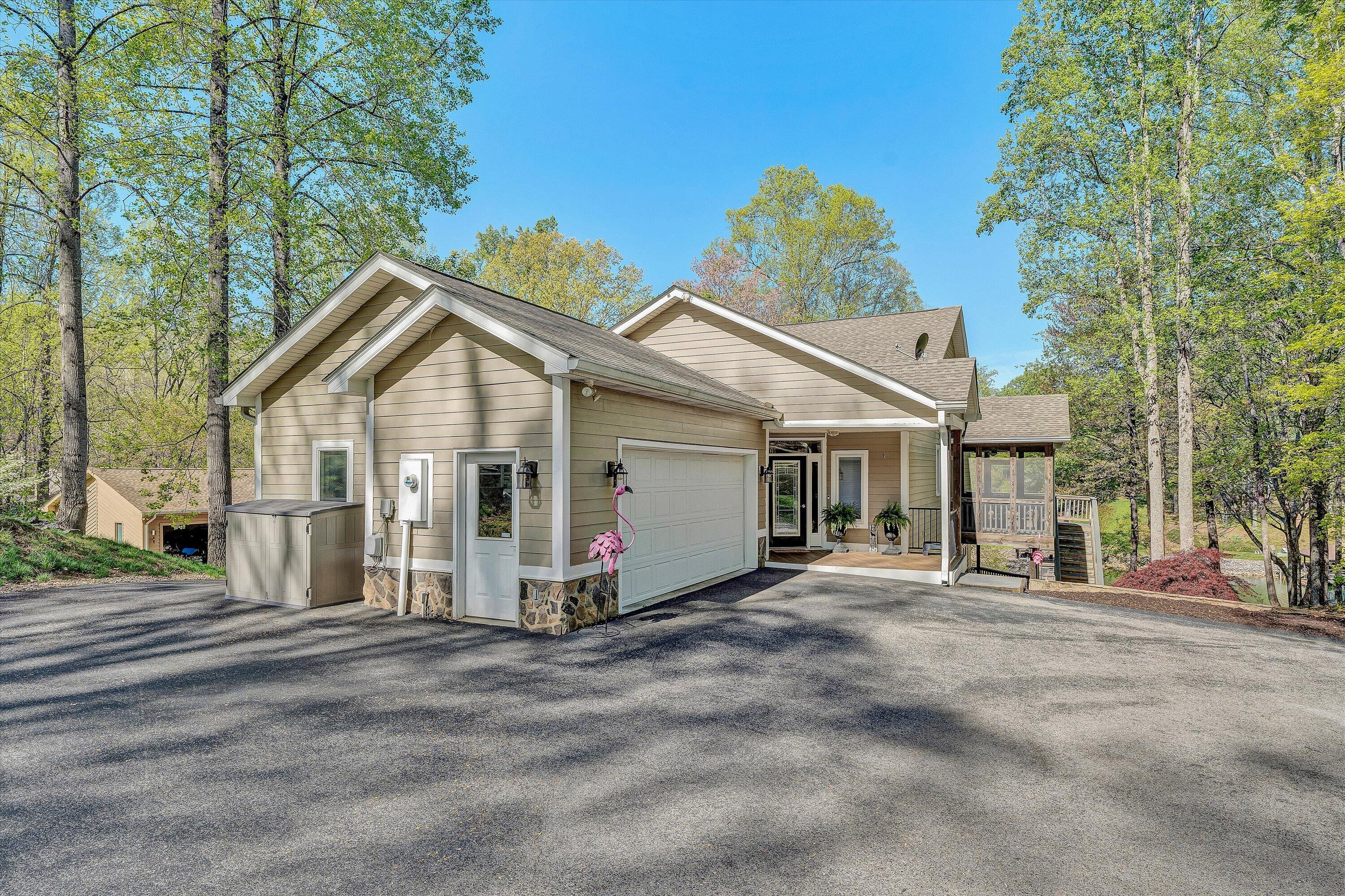 145 Channelview Drive Moneta, VA 24121 - Photo 22 of 62 a view of a house with a big yard and large trees