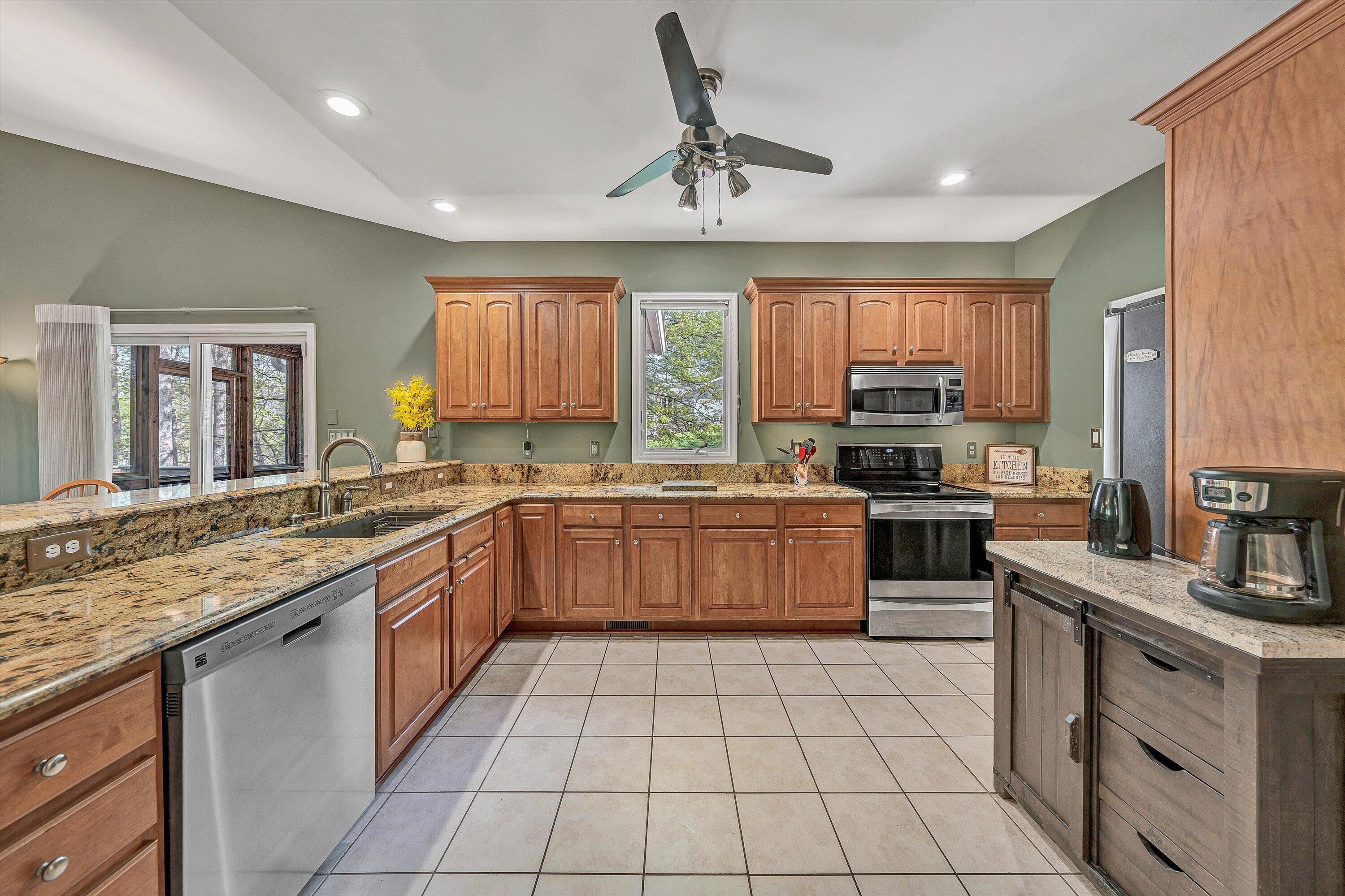 145 Channelview Drive Moneta, VA 24121 - Photo 26 of 62 a kitchen with stainless steel appliances granite countertop a stove sink and cabinets