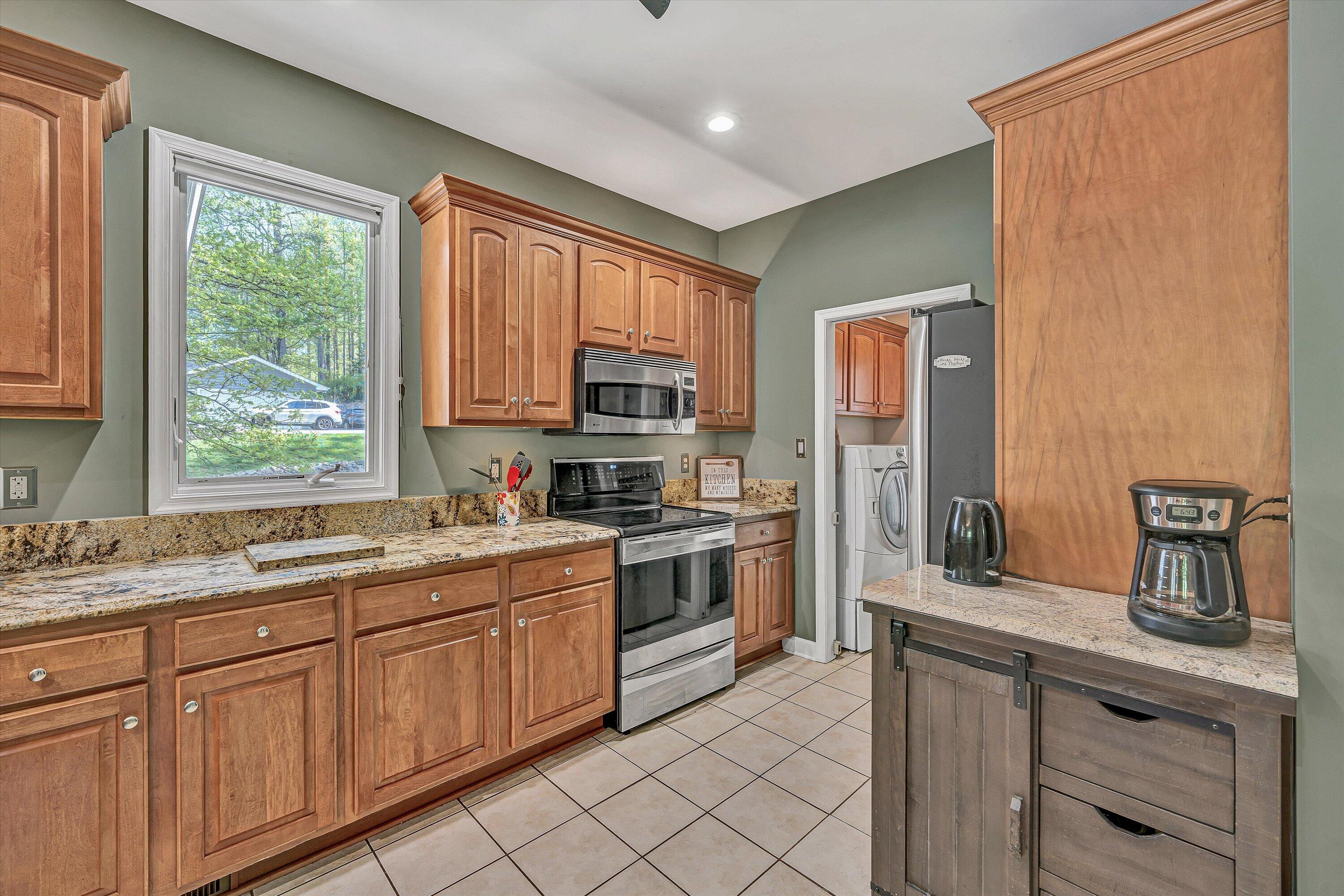 145 Channelview Drive Moneta, VA 24121 - Photo 27 of 62 a kitchen with a sink stove and microwave