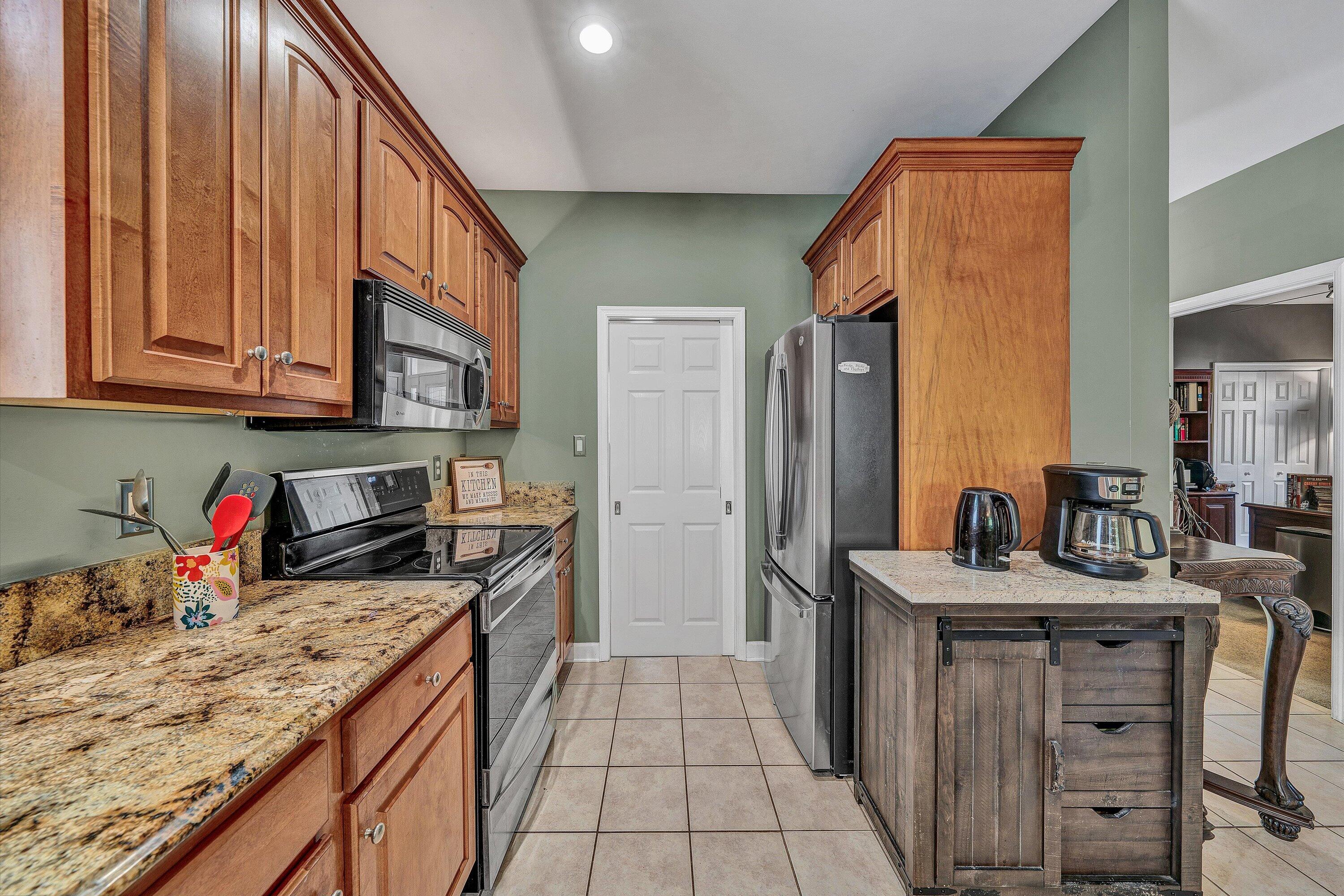 145 Channelview Drive Moneta, VA 24121 - Photo 28 of 62 a kitchen with stainless steel appliances granite countertop a sink stove and refrigerator
