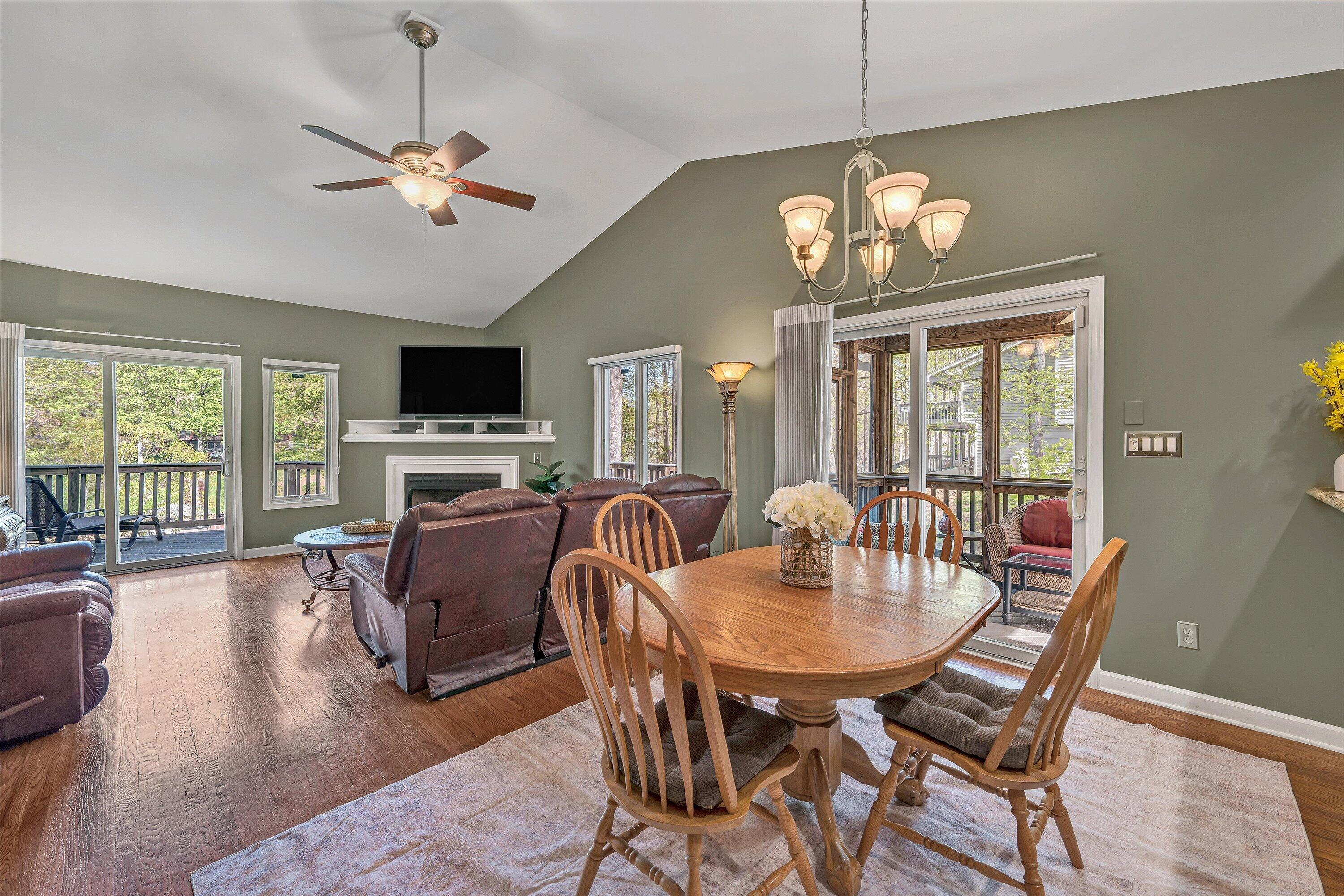 145 Channelview Drive Moneta, VA 24121 - Photo 32 of 62 a view of a dining room with furniture a chandelier and wooden floor