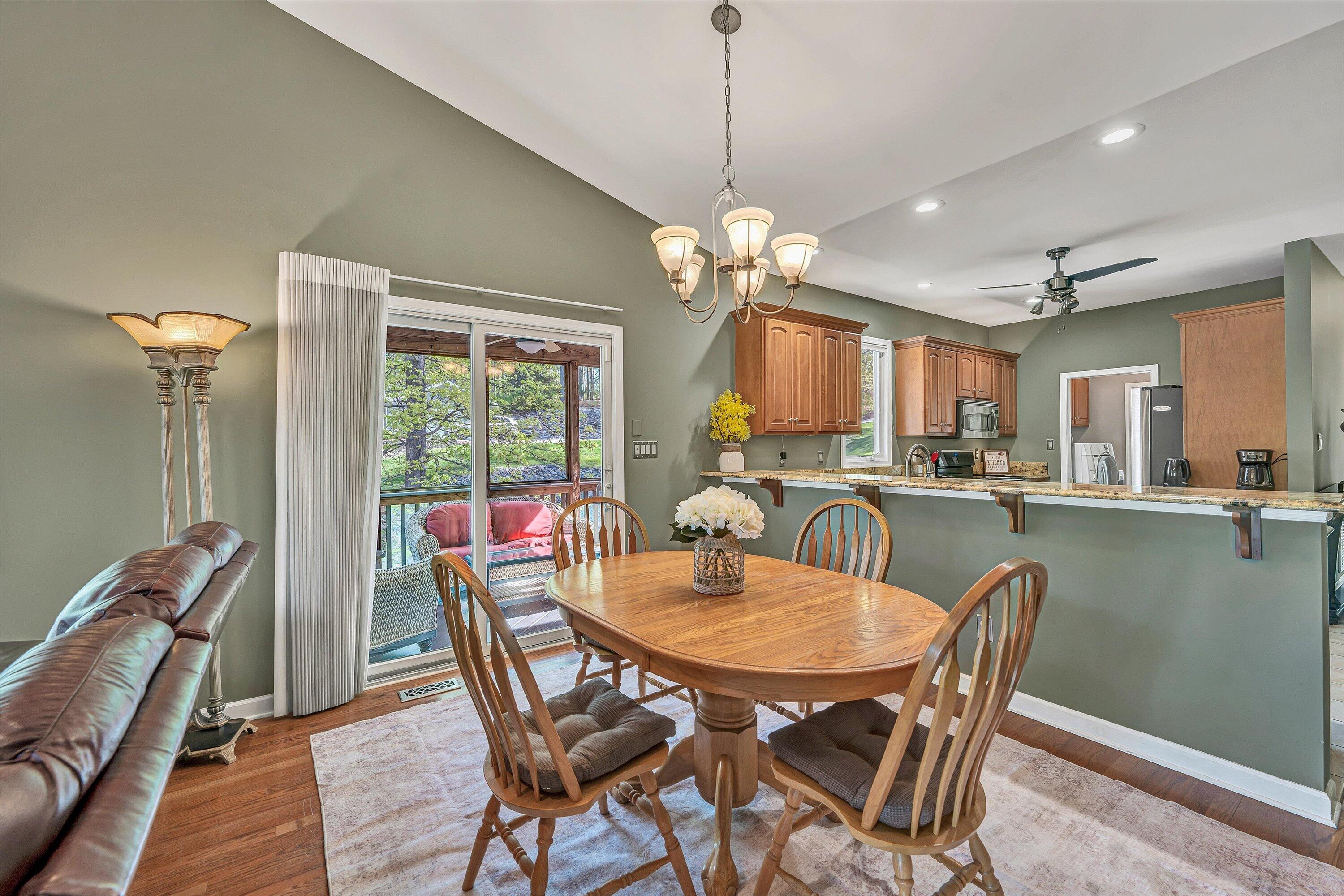 145 Channelview Drive Moneta, VA 24121 - Photo 33 of 62 a view of a dining room with furniture window and wooden floor