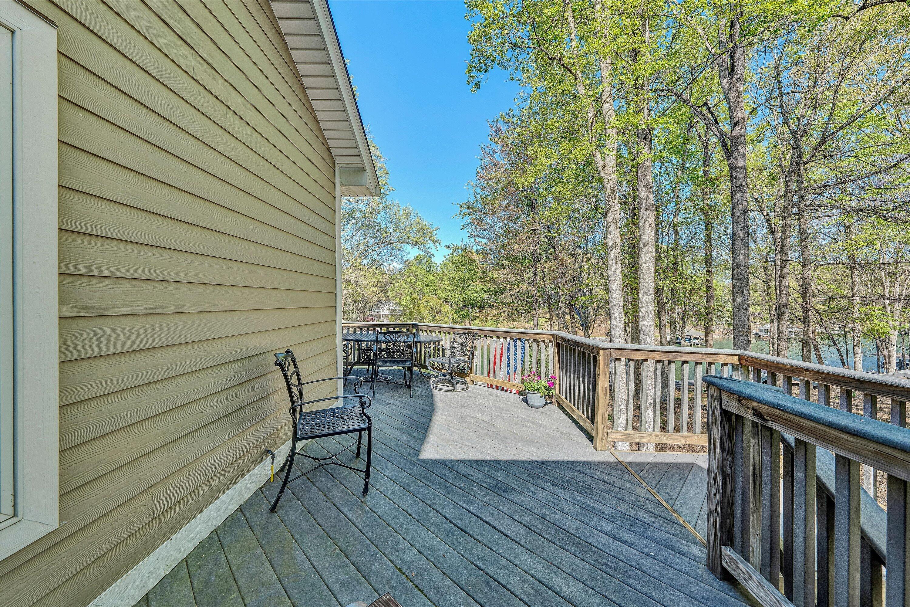 145 Channelview Drive Moneta, VA 24121 - Photo 39 of 62 a view of deck with furniture and trees around