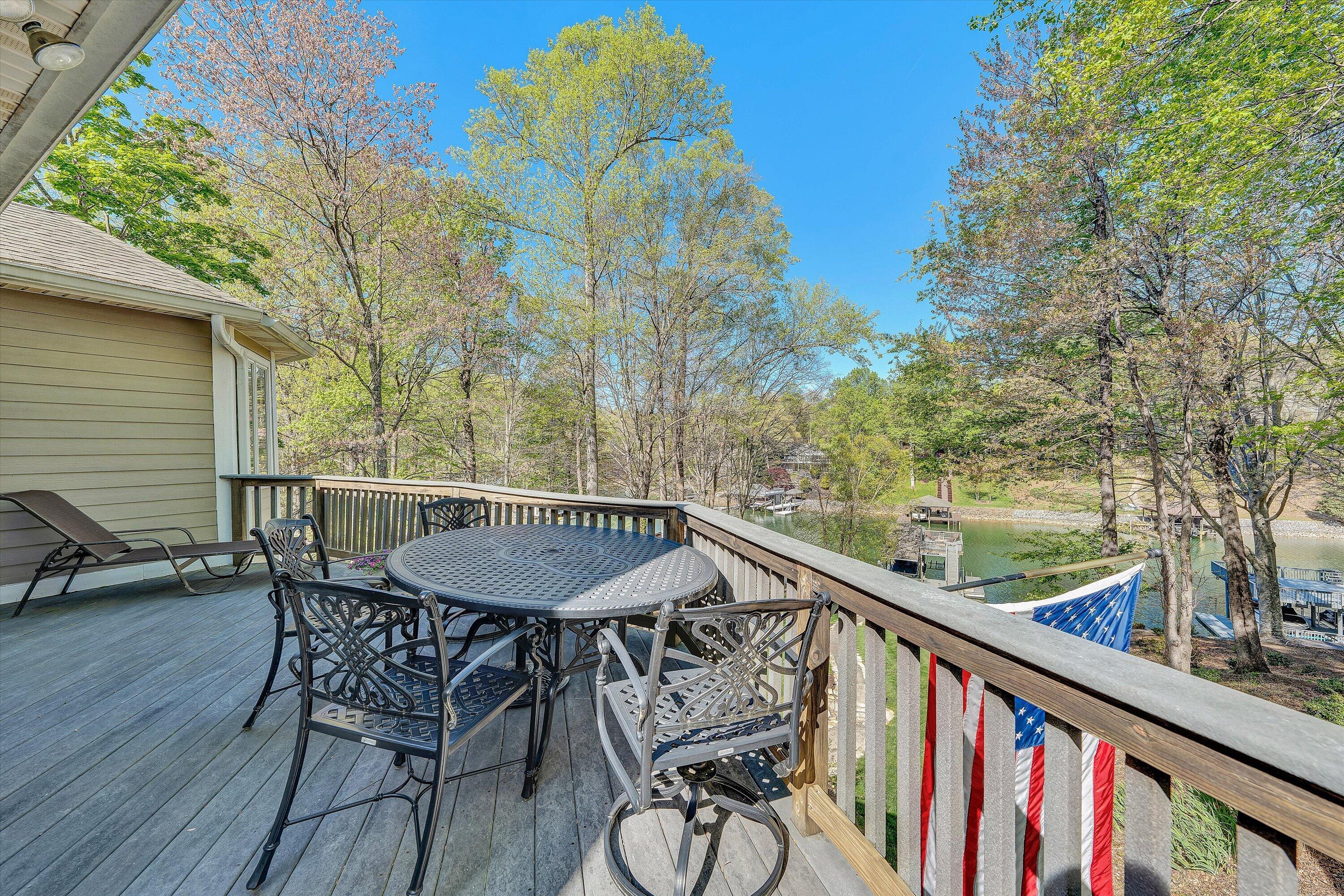 145 Channelview Drive Moneta, VA 24121 - Photo 40 of 62 a view of a chairs and table in patio