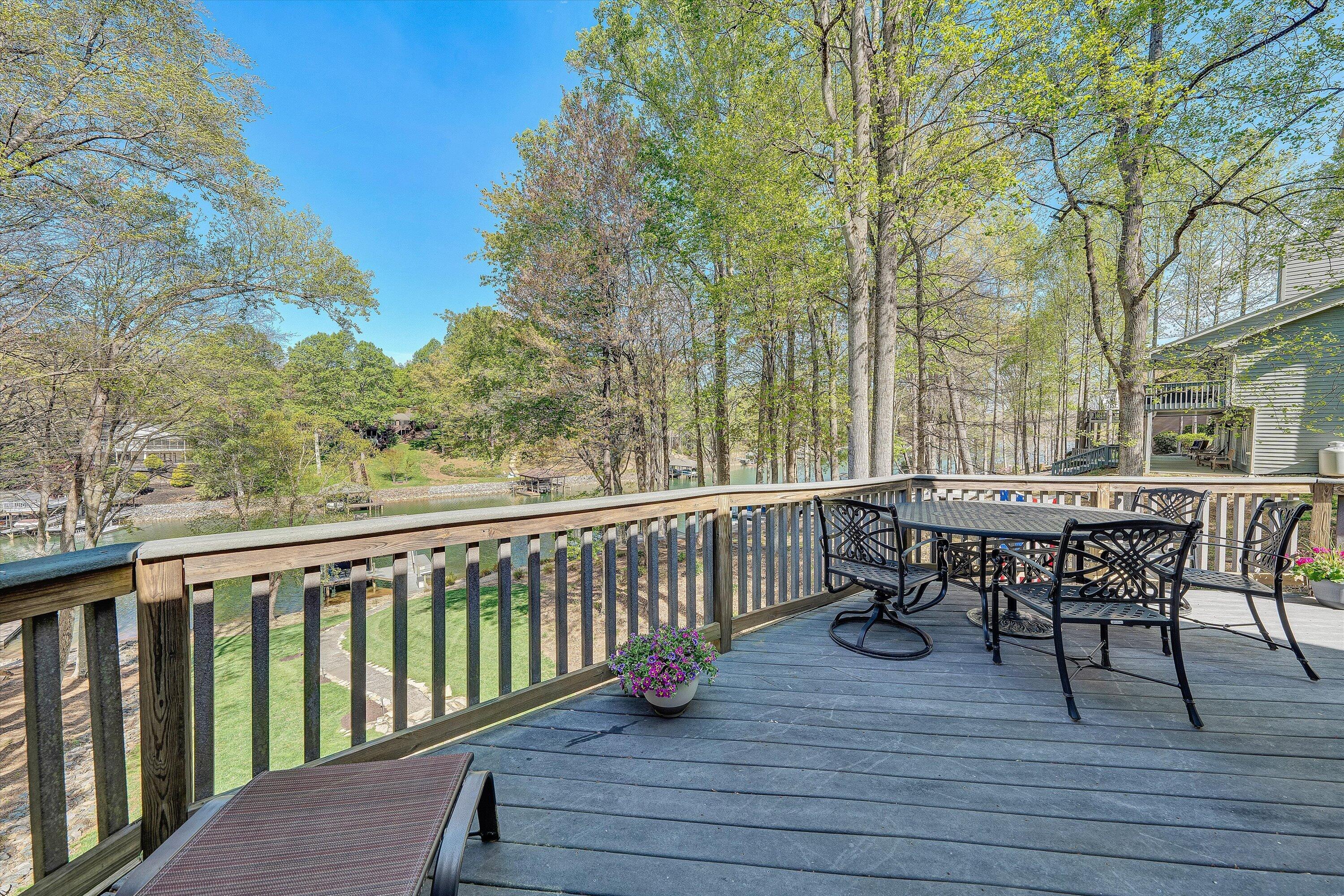 145 Channelview Drive Moneta, VA 24121 - Photo 41 of 62 a view of a chairs and table on the deck