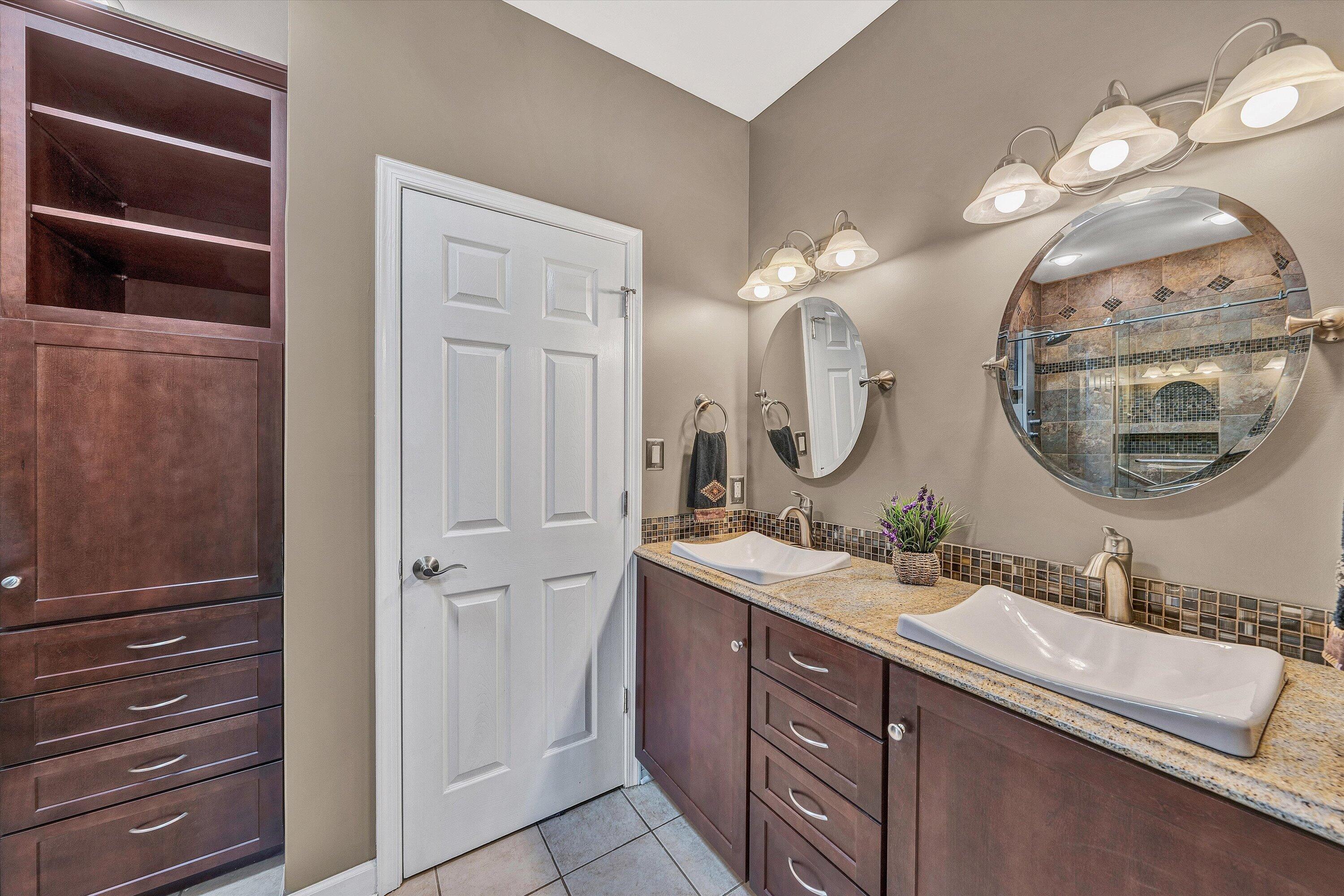 145 Channelview Drive Moneta, VA 24121 - Photo 44 of 62 a bathroom with a double vanity sink and a mirror