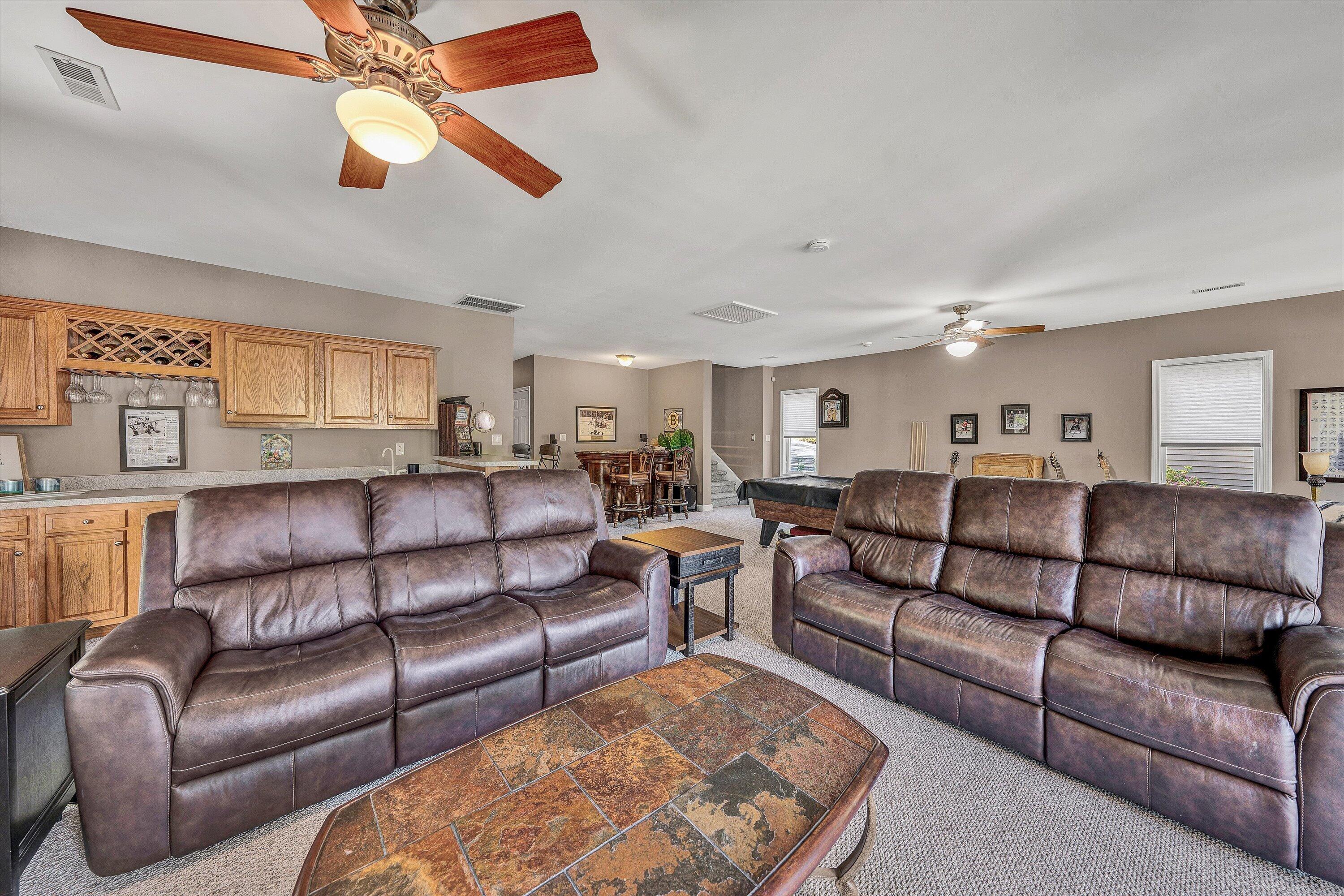 145 Channelview Drive Moneta, VA 24121 - Photo 49 of 62 a living room with furniture ceiling fan and a rug
