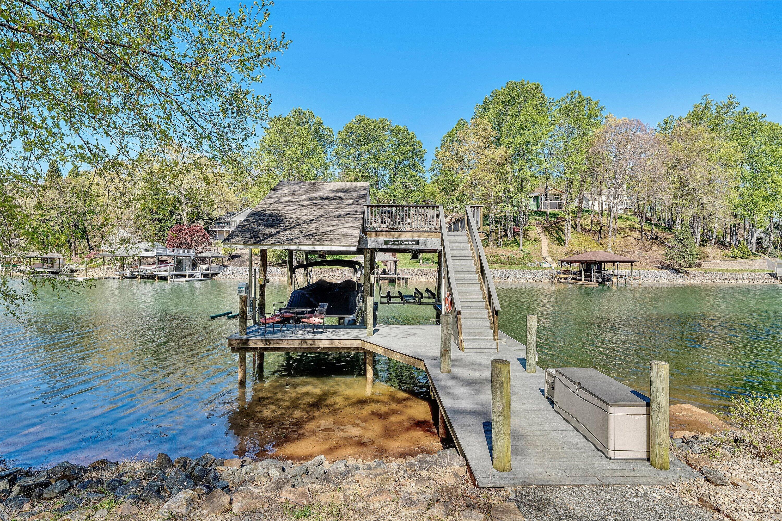 145 Channelview Drive Moneta, VA 24121 - Photo 60 of 62 a view of a lake with a deck and a lake view