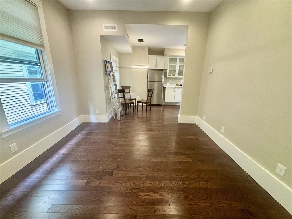 48 Magazine Street, Unit 3 Cambridge, MA 02139 - Photo 2 of 15 a view of empty room with wooden floor