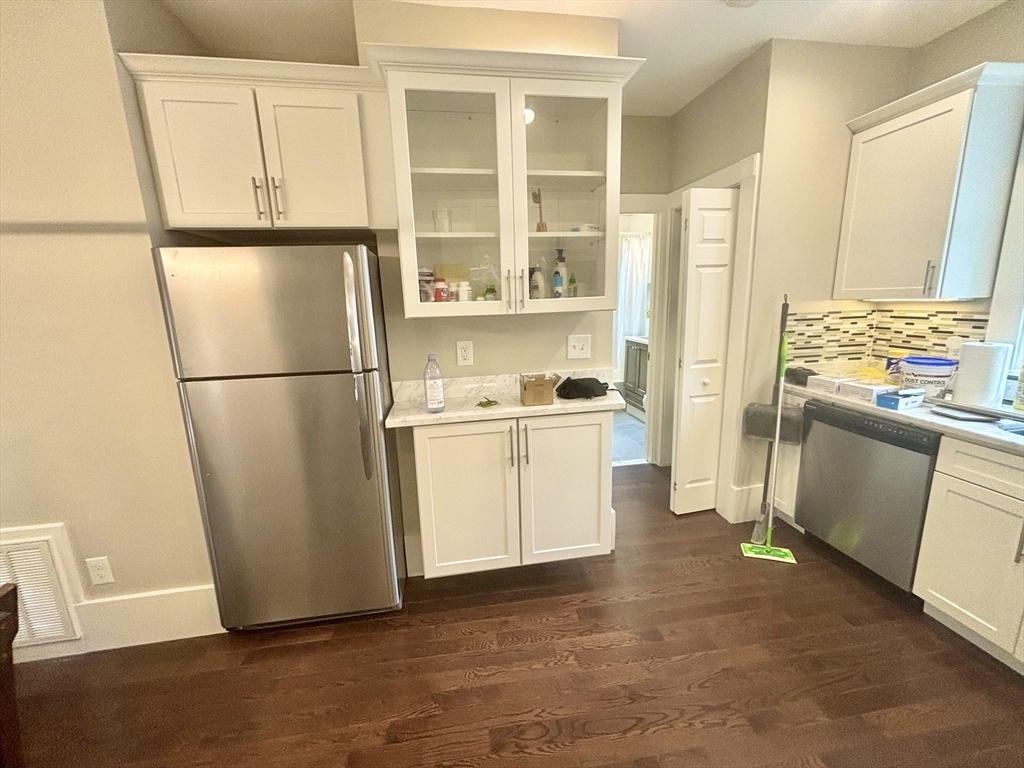 48 Magazine Street, Unit 3 Cambridge, MA 02139 - Photo 5 of 15 a kitchen with white cabinets and white appliances