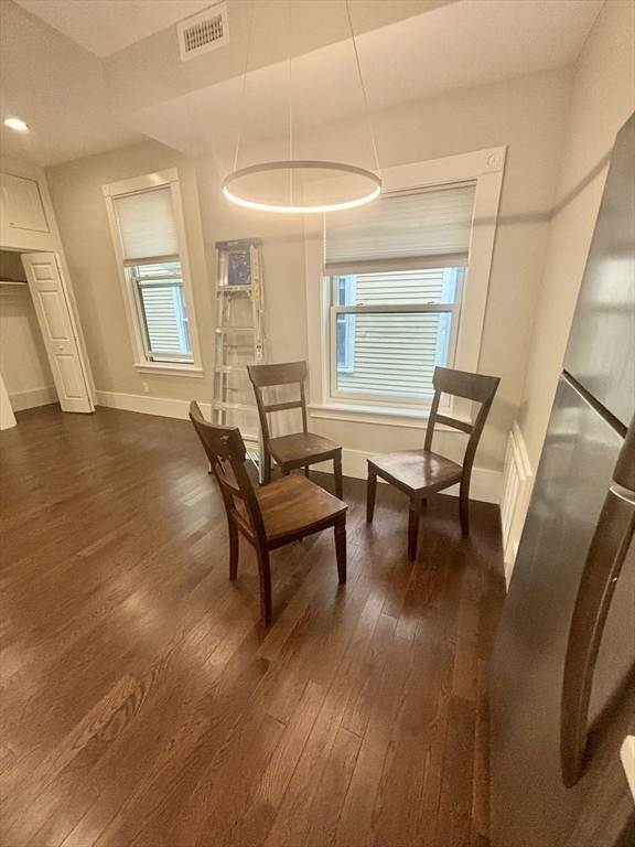 48 Magazine Street, Unit 3 Cambridge, MA 02139 - Photo 7 of 15 a living room with furniture and a wooden floor