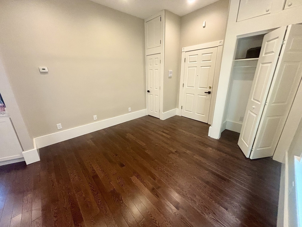 48 Magazine Street, Unit 3 Cambridge, MA 02139 - Photo 8 of 15 an empty room with wooden floor and entrance