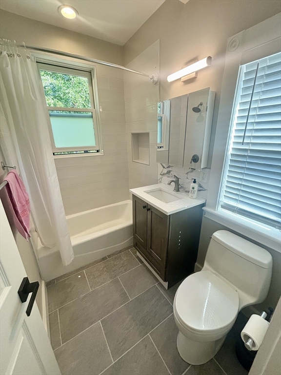 48 Magazine Street, Unit 3 Cambridge, MA 02139 - Photo 10 of 15 a bathroom with a sink toilet and shower