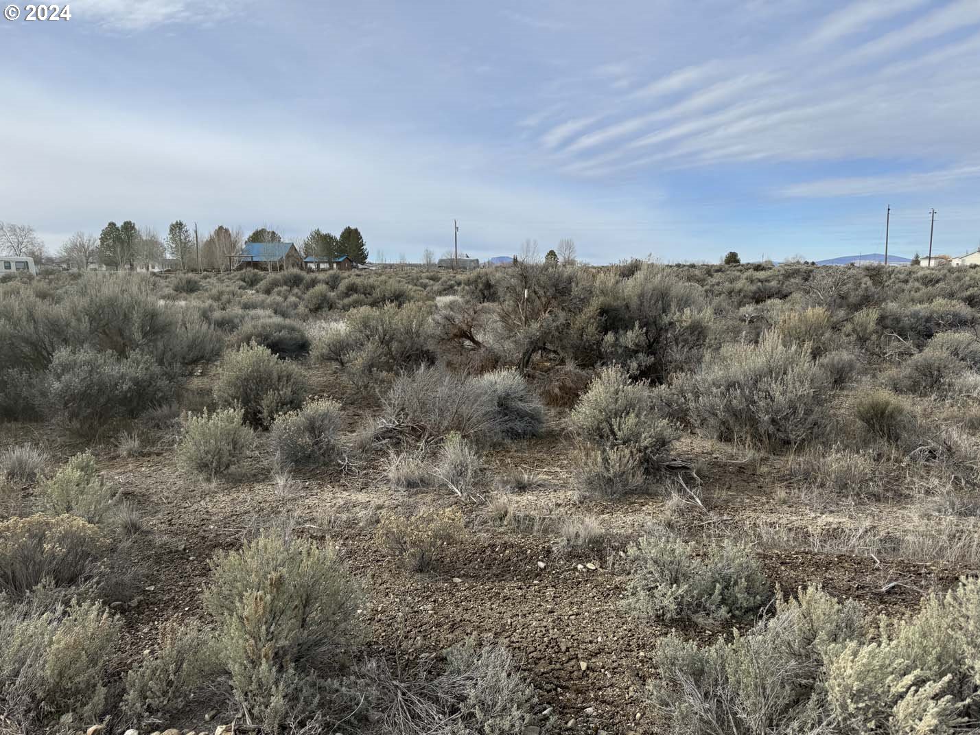 Twilight Road, Unit 3700 Christmas Valley, OR 97641 - Photo 20 of 21 a view of a city with lush green forest