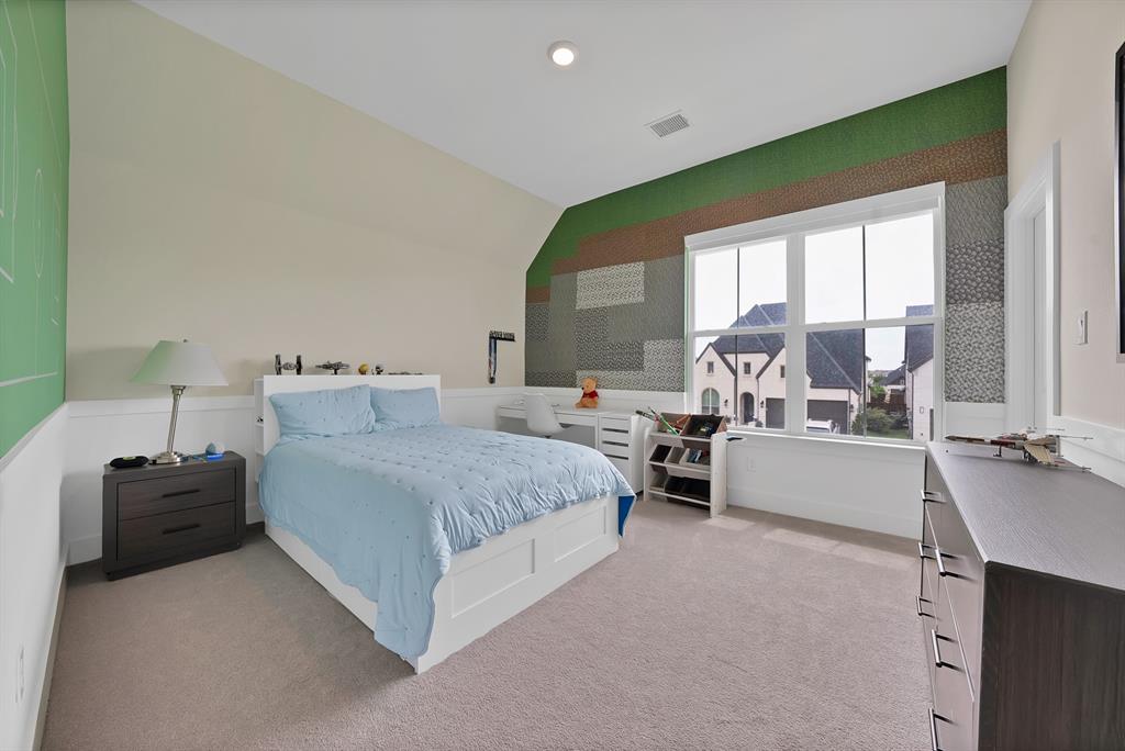 1010 Adair Road Prosper, TX 75078 - Photo 23 of 39 a spacious bedroom with a bed and a large window