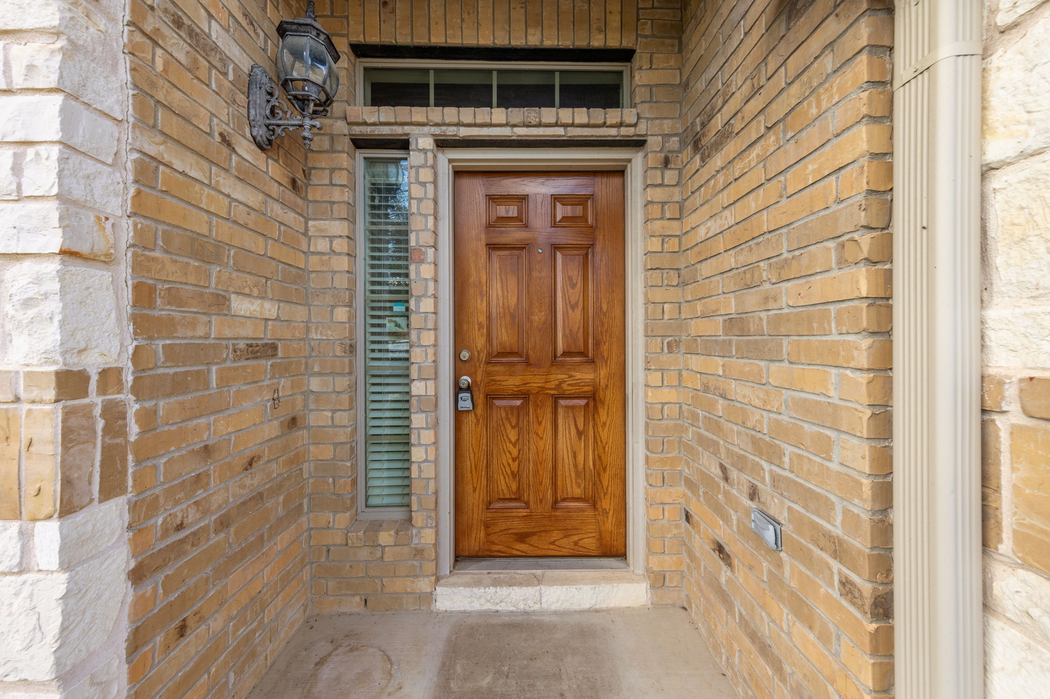 411 Tascate Street Georgetown, TX 78628 - Photo 3 of 41 A classic brick and stone facade welcomes all to this inviting home's entry.