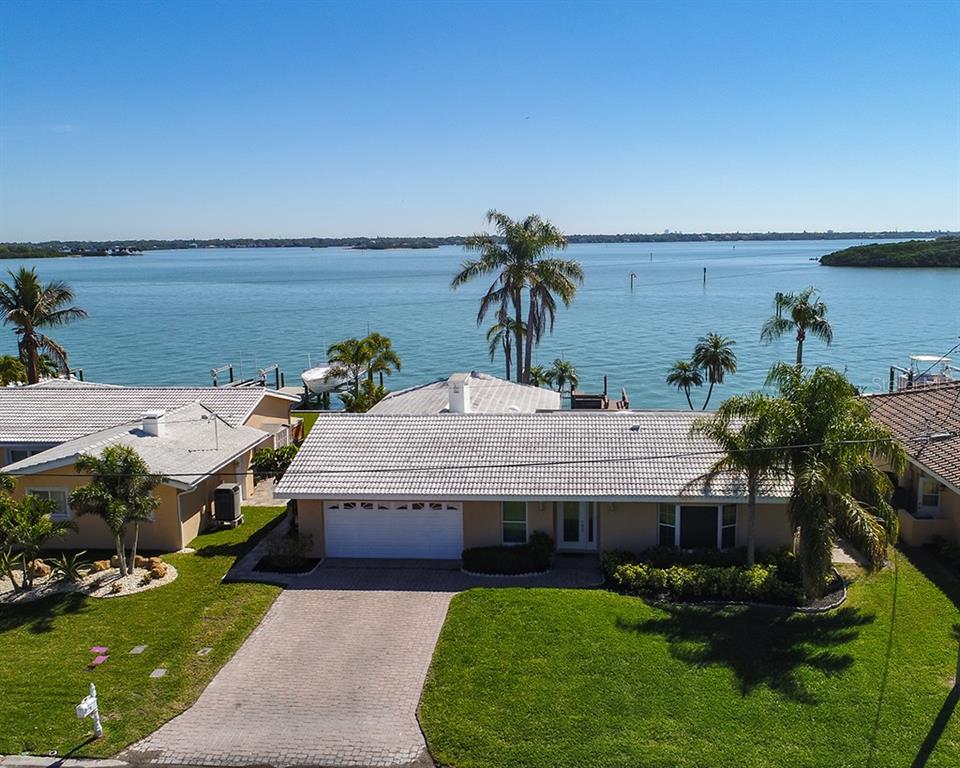 a swimming pool with outdoor seating and yard