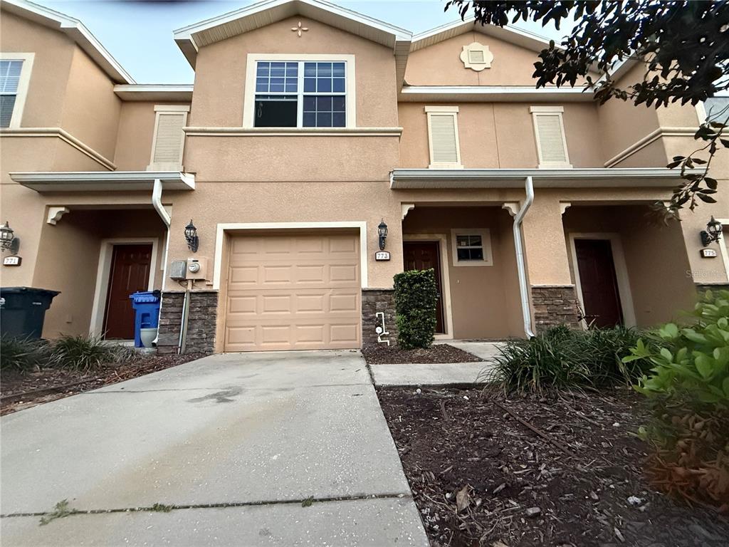 773 Spring Flowers Trail Brandon, FL 33511 - Photo 1 of 1 a front view of a house with garden