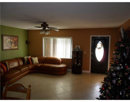 11154 Delta Circle Boca Raton, FL 33428 - Photo 5 of 6 a living room with furniture and a large window