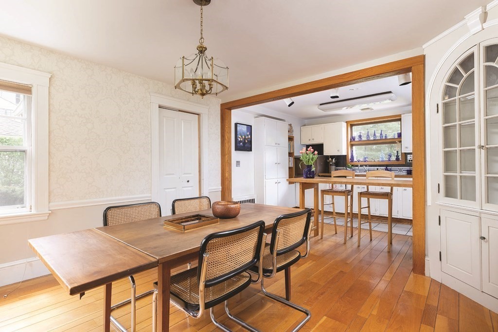 11 Ridgeway Terrace Newton, MA 02464 - Photo 3 of 10 a dining room with furniture a chandelier and wooden floor