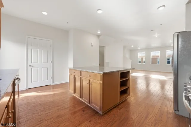 a view of kitchen with furniture and wooden floor
