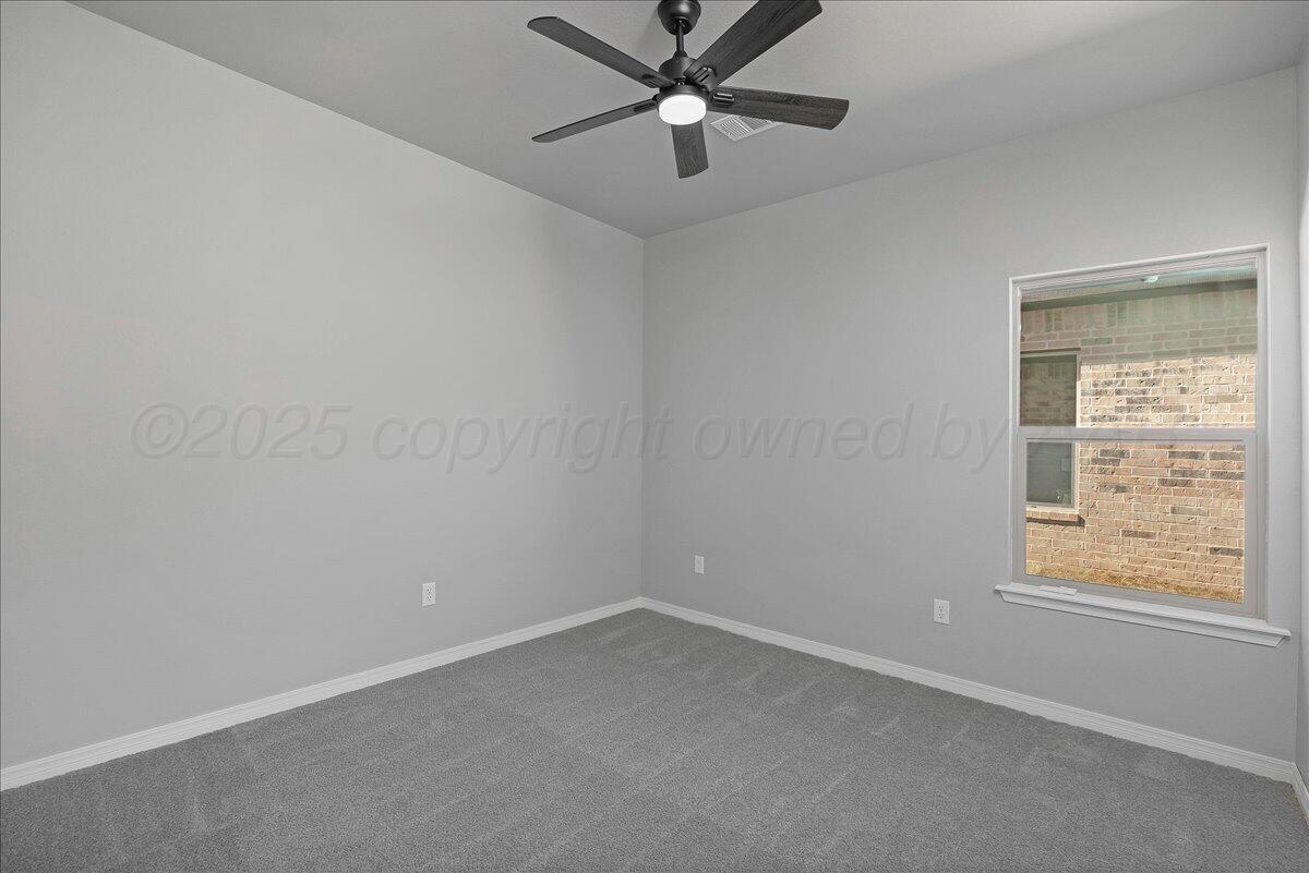 4206 Beacon Road Amarillo, TX 79118 - Photo 17 of 23 an empty room with a window and a fan