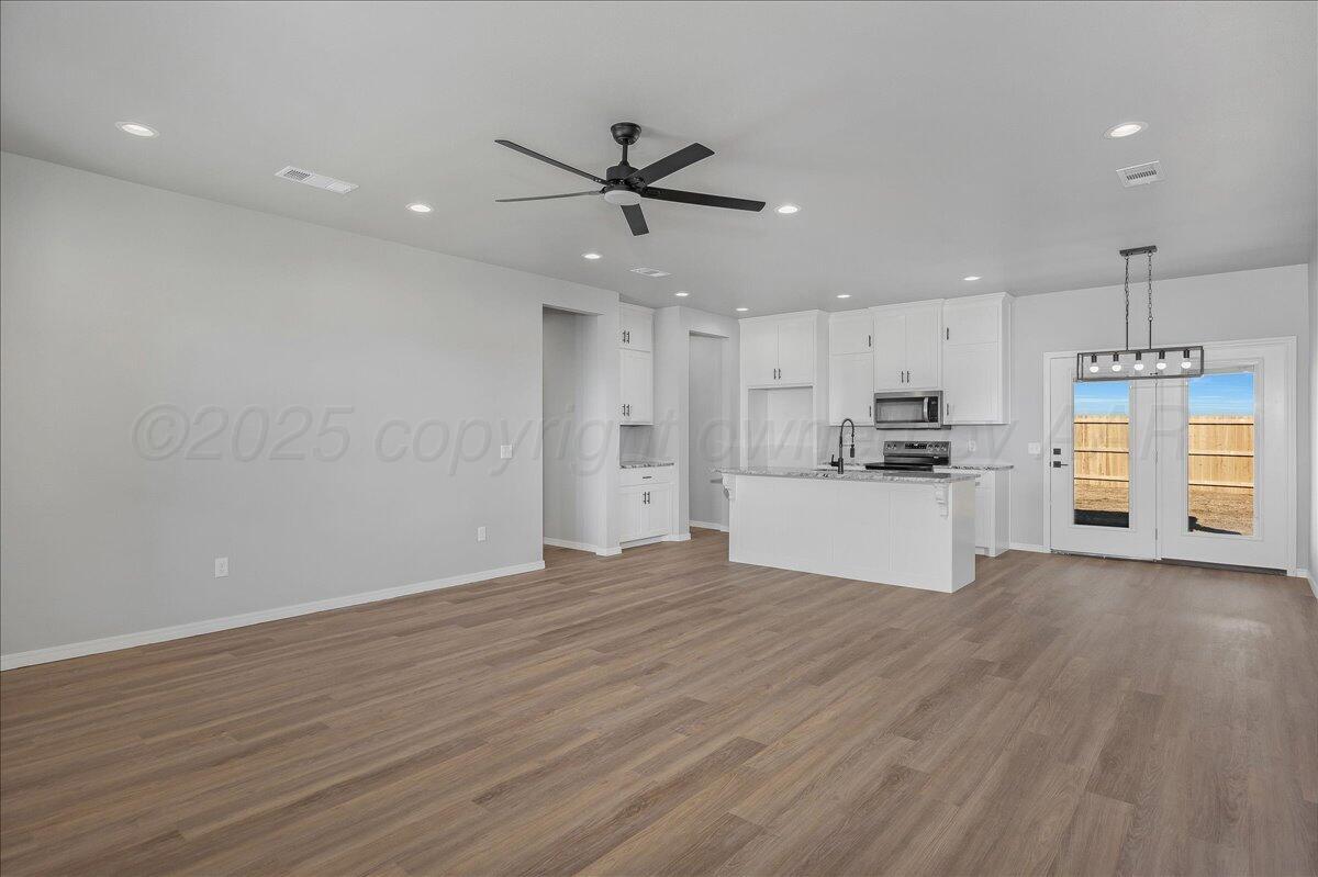 4206 Beacon Road Amarillo, TX 79118 - Photo 4 of 23 a view of a kitchen with a sink and wooden floor
