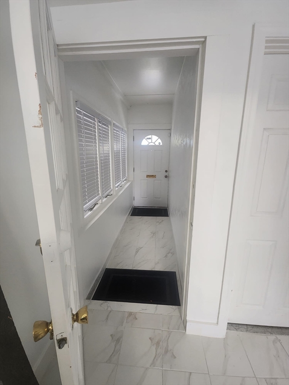 1203 Bennington Street Boston, MA 02128 - Photo 6 of 25 a bathroom with a sink and mirror