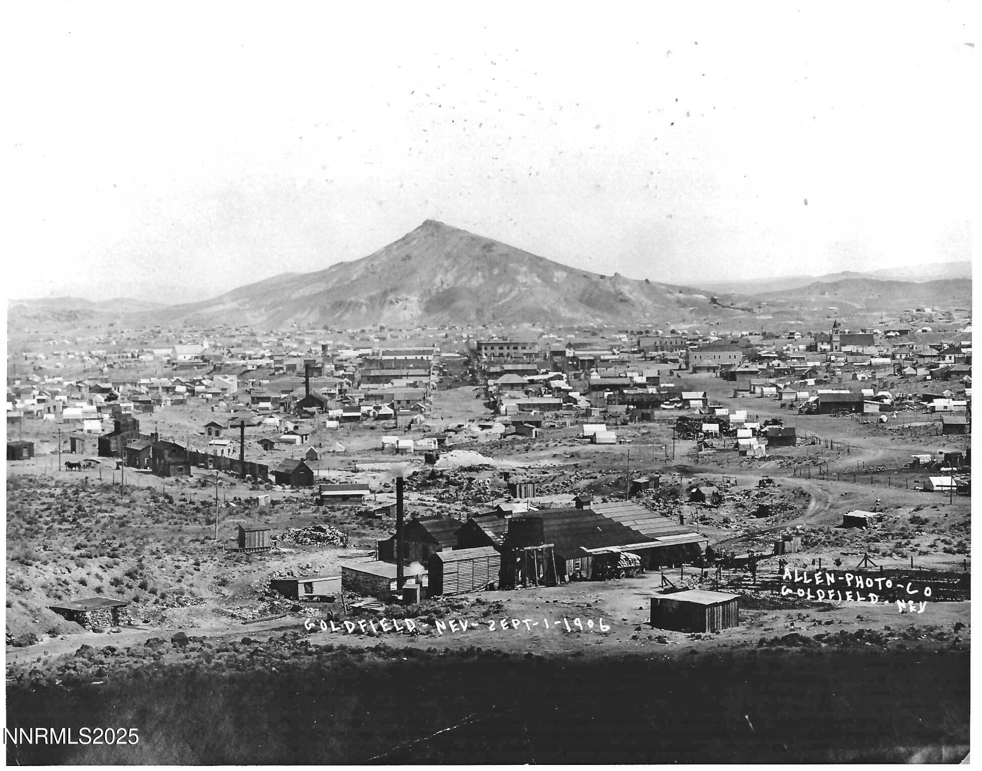 an aerial view of residential house and car parked