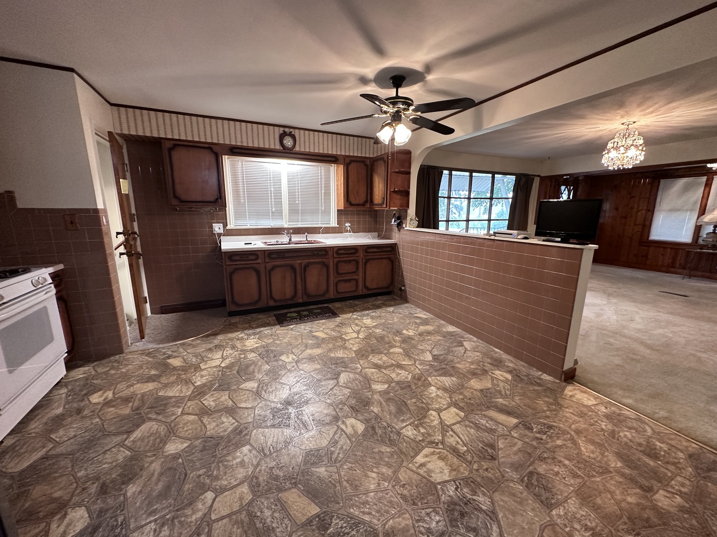 12454 Cracker Road Farmer City, IL 61842 - Photo 8 of 23 a large room with a large bed furniture a chandelier and a large window