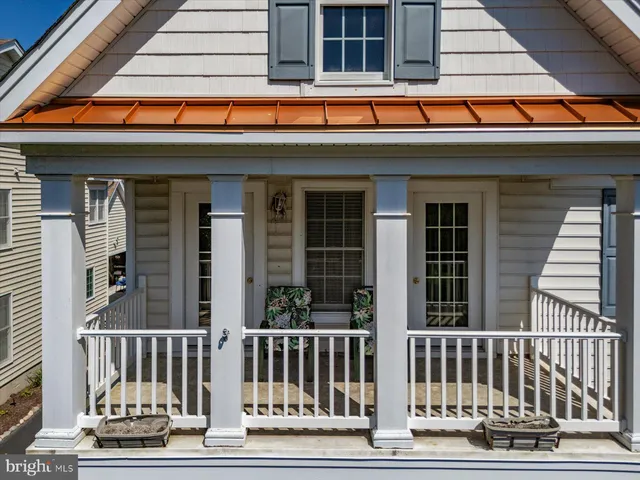 a kitchen with stainless steel appliances granite countertop a stove a sink a microwave a island with a dining table and chair