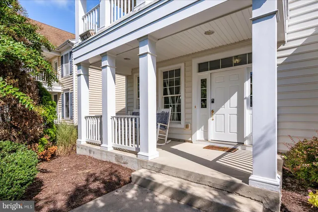 a kitchen with stainless steel appliances granite countertop a stove a sink and white cabinets