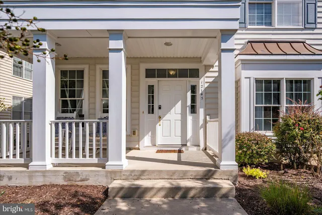 a kitchen with stainless steel appliances granite countertop a refrigerator a sink a stove top oven and cabinets