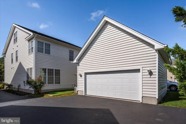 a dining room with furniture window and wooden floor