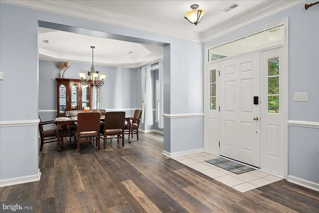 a bath tub sitting in a bathroom next to a window