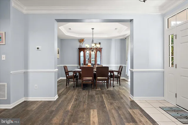 a room with a bed and wooden floor