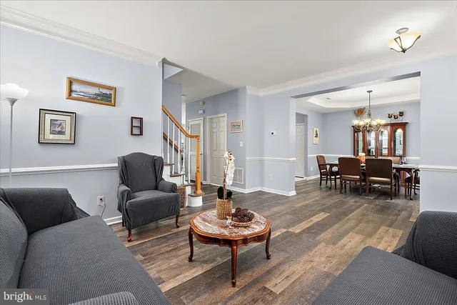 a bedroom with a bed a couch and a window