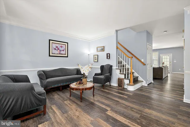 a bedroom with two beds and a couch