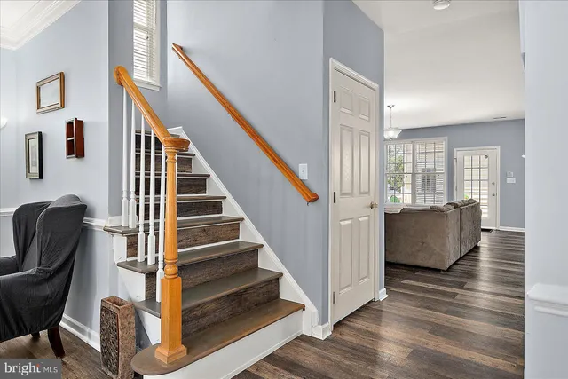 a view of a patio with lawn chairs floor to ceiling window and yard